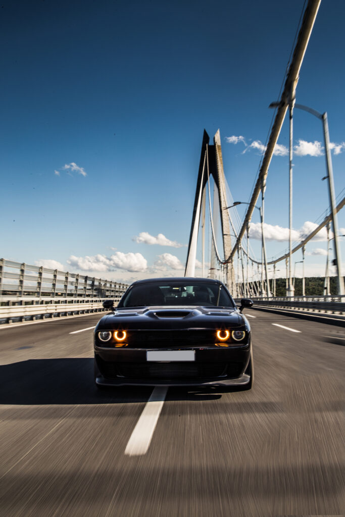 front view black sedan sport car bridge