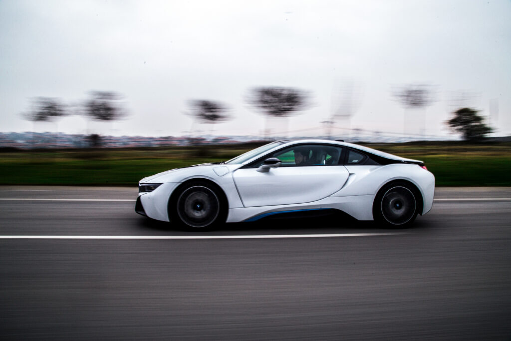 high speed test driving white sport car
